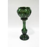 A Victorian earthenware green glazed jardiniere on stand,