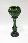 A Victorian earthenware green glazed jardiniere on stand,