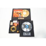 A collection of three Elvis Presley gold plated and silverized records,