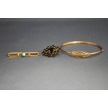 A 9 carat gold bangle; a turquoise and seed pearl bar brooch,