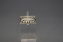 A seven stone diamond half hoop ring, stamped 'Pla', finger size K, 2.