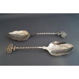 A pair of Victorian Gothic silver serving spoons, makers mark JAR, Sheffield 1872,
