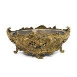 A pierced brass planter, heavily cast in the Rococo style with metal line,