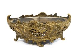 A pierced brass planter, heavily cast in the Rococo style with metal line,