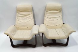 A pair of Norwegian bentwood armchairs with cream leather seats,