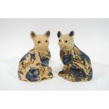 A pair of slipware pottery cats,