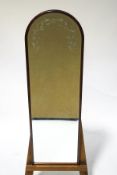 A 20th century bevelled glass wall mirror, with dome top,