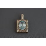 An aquamarine and diamond pendant,