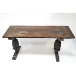 A 17th century and later oak refectory table with double plank top on two carved baluster supports