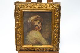 A print of a coquetish young lady, within a decorative gold painted cushion frame,