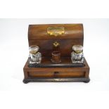 A Victorian rosewood desk set, comprising of enclosed arched letter rack, two glass inkwells,