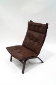 A 1970's Danish style bentwood chair, with button back brown leather seat,
