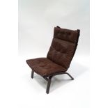 A 1970's Danish style bentwood chair, with button back brown leather seat,