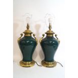 A pair of two handled brass mounted metal table lamps,