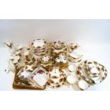 A large Royal Albert Old Country Roses dinner service for six settings,