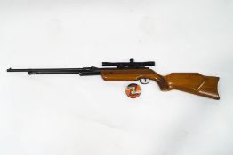 A Relim Tornado air rifle numbered 14248, with sight and a tin of .