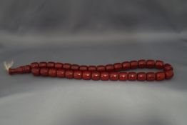 A red bakelite bead necklace ,