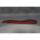 A red bakelite bead necklace ,