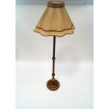 An ornate mahogany standard lamp,