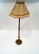 An ornate mahogany standard lamp,