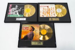 A collection of three gold plated Elvis Presley LP records