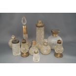 A collection of ten toilet bottles, some for scent,