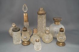 A collection of ten toilet bottles, some for scent,