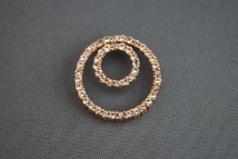 A stone set double hoop pendant, stamped '9k', 2.
