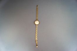 Rotary, a lady's 9 carat gold wrist watch on a bracelet,