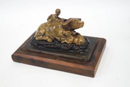 A Chinese soapstone carving of a recumbent water buffalo and it's calf, with a boy upon it's back,