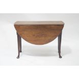 A George III mahogany oval drop leaf pad foot dining table, 72cm high x 101.