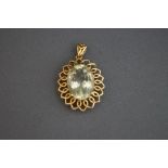 An aquamarine pendant, stamped '9k', the oval cut in a wire mount, 4.