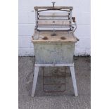 An early galvanised metal and wooden laundry machine, incorporating a mangle,