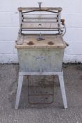 An early galvanised metal and wooden laundry machine, incorporating a mangle,