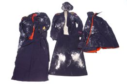 A WWII nurse's uniform comprising: a jacket, two skirts, cape, long coat,