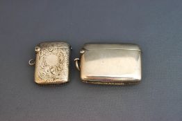 A plain silver vesta case; and another with engraved decoration; 39 g (1.