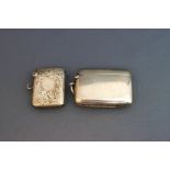 A plain silver vesta case; and another with engraved decoration; 39 g (1.