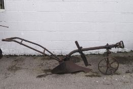 An old cast iron horse drawn plough