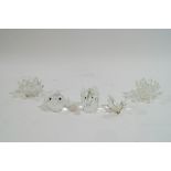 Five Swarovski Crystal ornaments: Fish, Butterfly, Elephant, and a pair of Waterlilies,