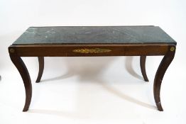 A Regency style mahogany coffee table, with reeded legs and gilt metal mounts,