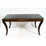 A Regency style mahogany coffee table, with reeded legs and gilt metal mounts,