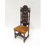 A Victorian oak hall chair, carved in the 17th century style,