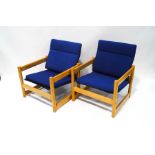 A pair of 1970's Habitat 'Campus' armchairs with beech frames and Pirelli rubber seat supports