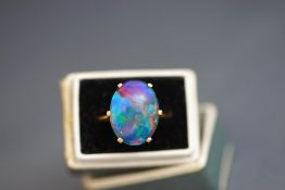 An opal triplet ring, unmarked, finger size K, 5 g gross,