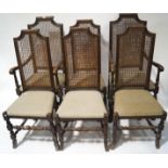 A set of six 17th century style oak chairs with caned backs and drop in seats,