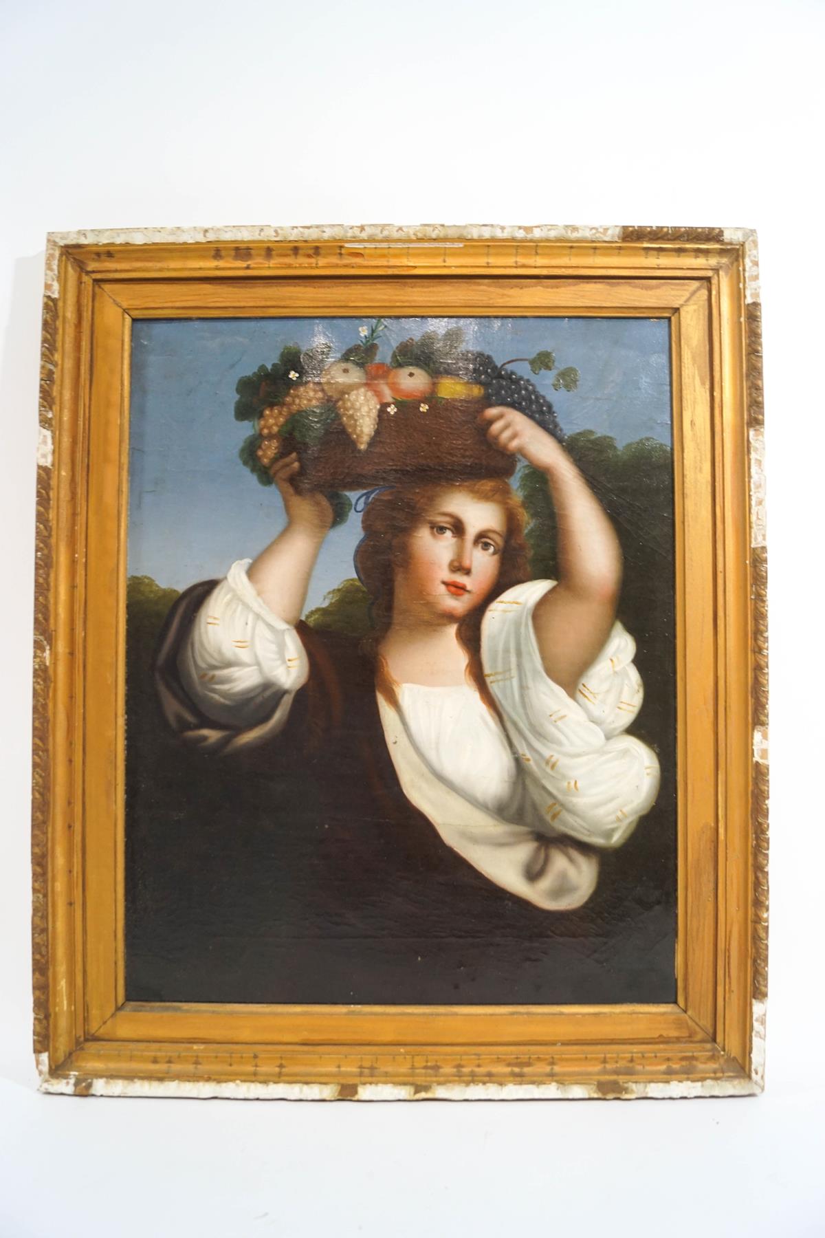 Continental School Lady carrying a basket of fruit Oil on canvas 58cm x 46cm