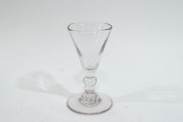 An 18th century drinking glass, with single knop stem,