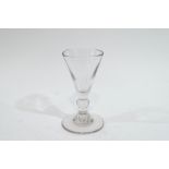 An 18th century drinking glass, with single knop stem,