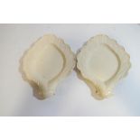 A pair of 18th century English Creamware dishes, both moulded with shell shaped handles,