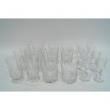 A suite of engraved glass in three sizes, comprising eight sherry glasses,